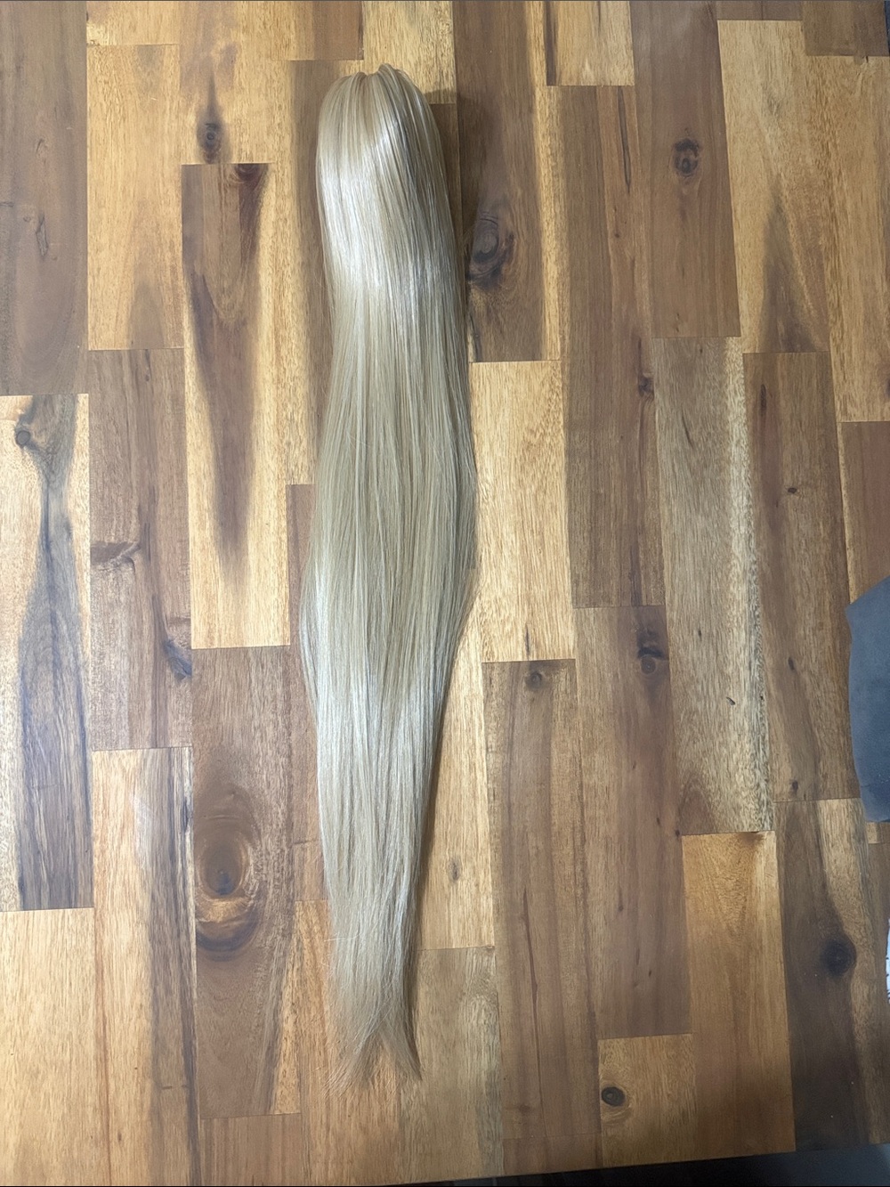 2/$40. 24” Synthetic Clip-In Ponytail Extension - Natural Blonde